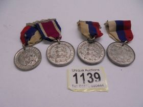Four Dorset County Council attendance medals.
