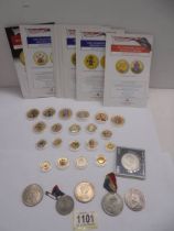 A quantity of The Changing Face of Britains coinage Golden Edition coins and other coins.