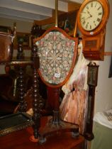 A Victorian mahogany pole screen. COLLECT ONLY.