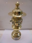A rare polished brass lamp, 30 cm tall.