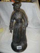 An early 20th century spelter figure (good repair to arm).