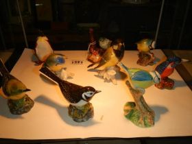 Nine assorted bird figures including Beswick.