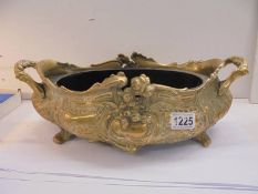 A French Regency style brass planter with metal liner.