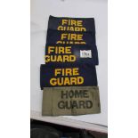 An original WW2 home guard arm band and four fire guard arm band of indeterminate age.