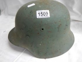 A WW2 German metal helmet.