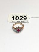A 9ct yellow gold ruby and diamond ring, size M, 2.6 grams.