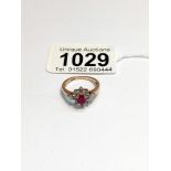 A 9ct yellow gold ruby and diamond ring, size M, 2.6 grams.