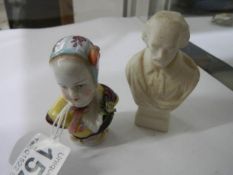 An early continental porcelain bust paperweight and one other.