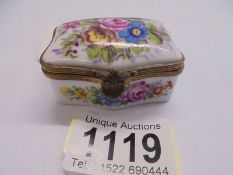 An early 20th century hand painted porcelain pill box, 5.5 x 4 cm.