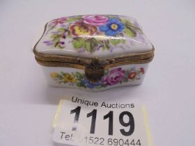 An early 20th century hand painted porcelain pill box, 5.5 x 4 cm.