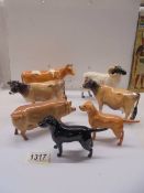 Seven Beswick animals including pig, ram, cattle and dogs.