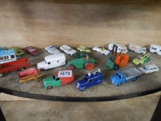 A mixed lot of old die cast vehicles.