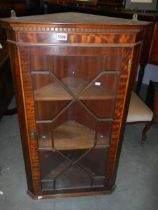 An early 20th century glazed corner cupboard with dental cornice, COLLECT ONLY.