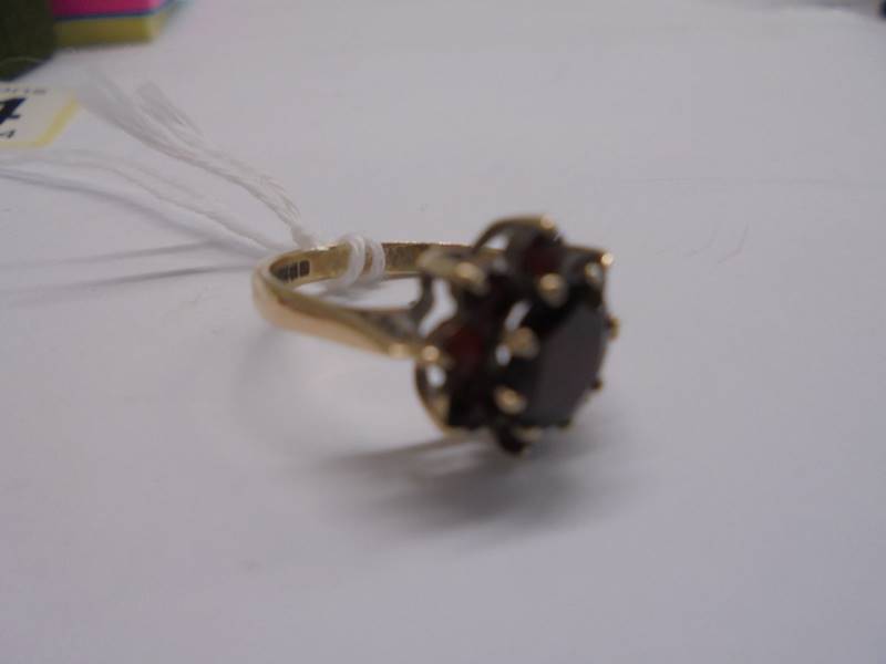 A 9ct gold ring set garnets, size J half, 2.2 grams. - Image 4 of 4