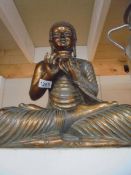 A large gold coloured praying Buddha figure, COLLECT ONLY.