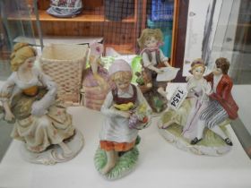 Five assorted porcelain figures.