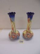 A pair of Old Tupton Ware hand painted vases, 20 cm tall.