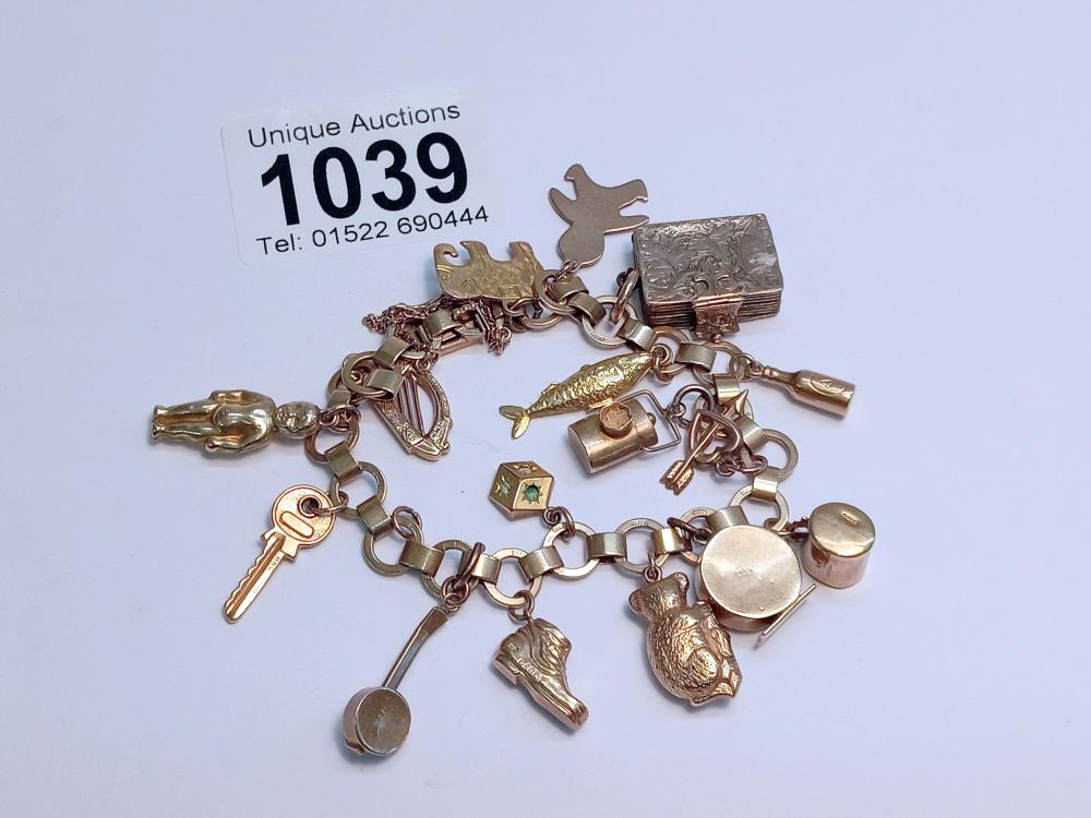 A 9ct gold charm bracelet, most charms marked, some unmarked but assured gold. 25 grams.
