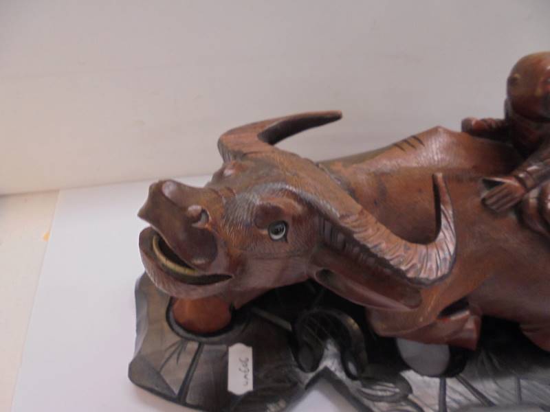 An Asian wooden buffaloo with two boys on its back. - Image 2 of 4