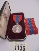 An Elizabeth II 'For Faithful Service' medal for Inspector's Post Office Kingston on Thames.