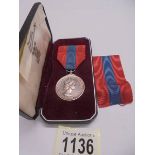 An Elizabeth II 'For Faithful Service' medal for Inspector's Post Office Kingston on Thames.