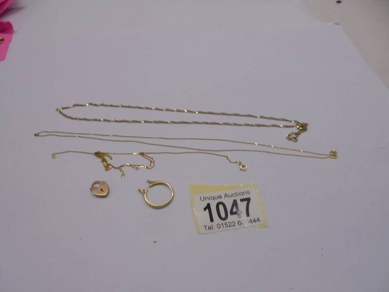 Three 9ct gold chains, a 9ct gold padlock (4.32 grams) and an a/f 18ct gold ring, (1.8 grams).