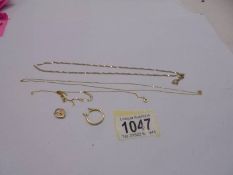 Three 9ct gold chains, a 9ct gold padlock (4.32 grams) and an a/f 18ct gold ring, (1.8 grams).