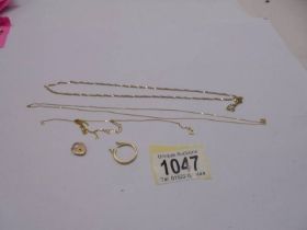 Three 9ct gold chains, a 9ct gold padlock (4.32 grams) and an a/f 18ct gold ring, (1.8 grams).