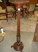 An early mahogany torchere. COLLECT ONLY.
