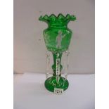 A 19th century green glass luster with Mary Gregory style decoration.