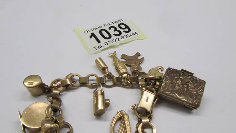 A 9ct gold charm bracelet, most charms marked, some unmarked but assured gold. 25 grams. - Image 3 of 3