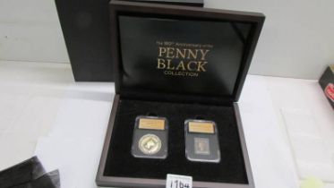 A cased 'Penny Black Collection' comprising a silver penny black and an 1840 penny black.
