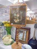 A 19th century mahogany pole screen on barley twist support with fruit embroidered panel. COLLECT