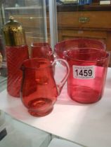 Five pieces of cranberry glass.