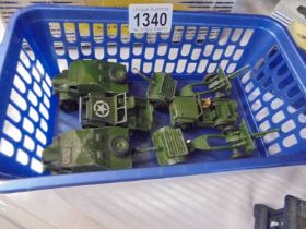 A good selection of Dinky military vehicles including Jeep, Austin Champ etc.,