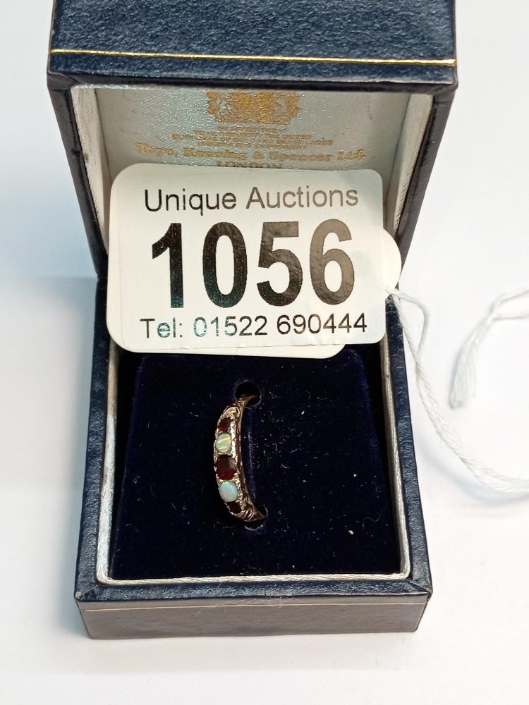 A 9ct gold ring set 5 stones, size H, 1.4 grams, (fitted with size reducer which could be removed).