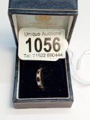 A 9ct gold ring set 5 stones, size H, 1.4 grams, (fitted with size reducer which could be removed).