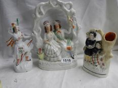 Three early 20th century Staffordshire figures.