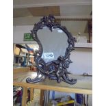 A metal framed art nouveau style mirror featuring cherubs.