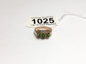 A 9ct yellow gold three stone emerald and diamond ring, size M half, 4.5 grams.