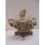 A large soapstone incense burner featuring lions.