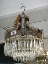 A small teardrop hall chandelier.