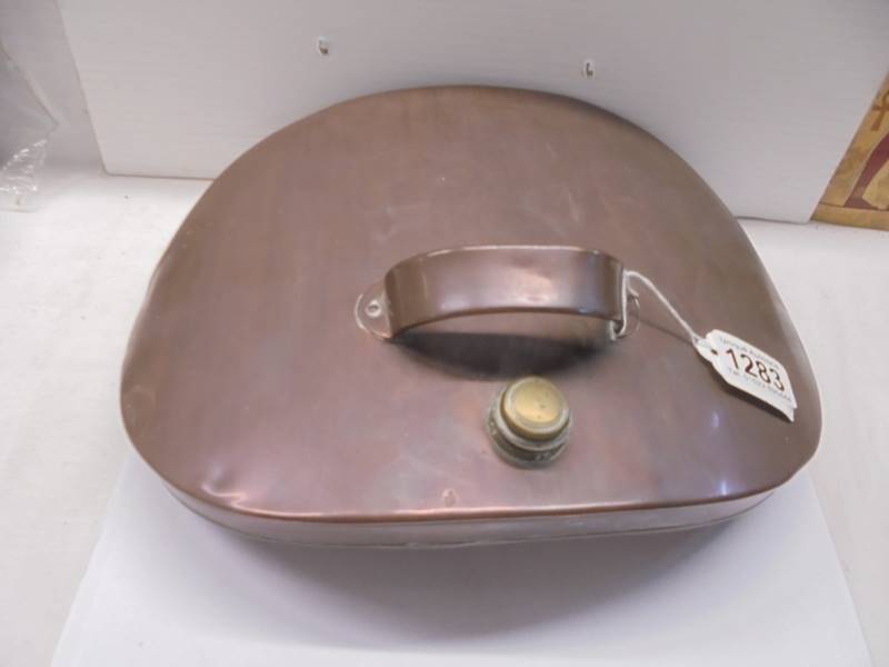 A 19th century copper foot warmer.