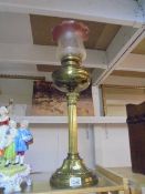 A brass Corinthian column oil lamp with Tulip shade, COLLECT ONLY.