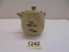 A miniature Oriental porcelain teapot.