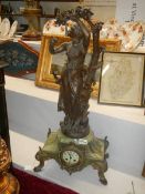 A French mantle clock surmounted female figure, COLLECT ONLY.