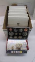 Six boxed de-luxe proof coin sets in cases and with booklets etc.,