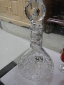 An early 20th century cut glass decanter.