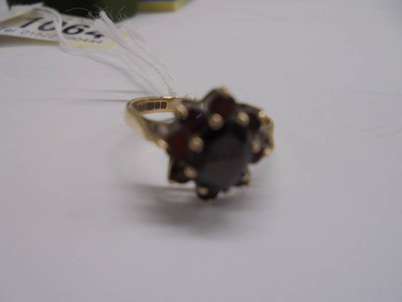 A 9ct gold ring set garnets, size J half, 2.2 grams. - Image 3 of 4