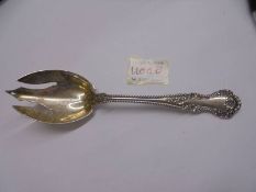 A sterling silver PAT 1899 salad serving fork, approximately 80 grams.